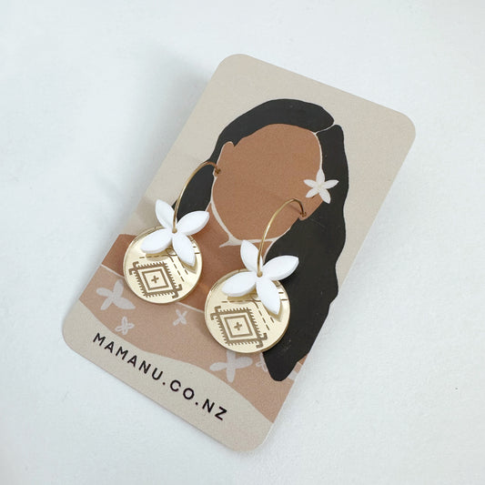 Pair of Pasifika, Polynesian-inspired earrings. Featuring a white ‘tipani’ motif and ‘Malu’ pattern. 